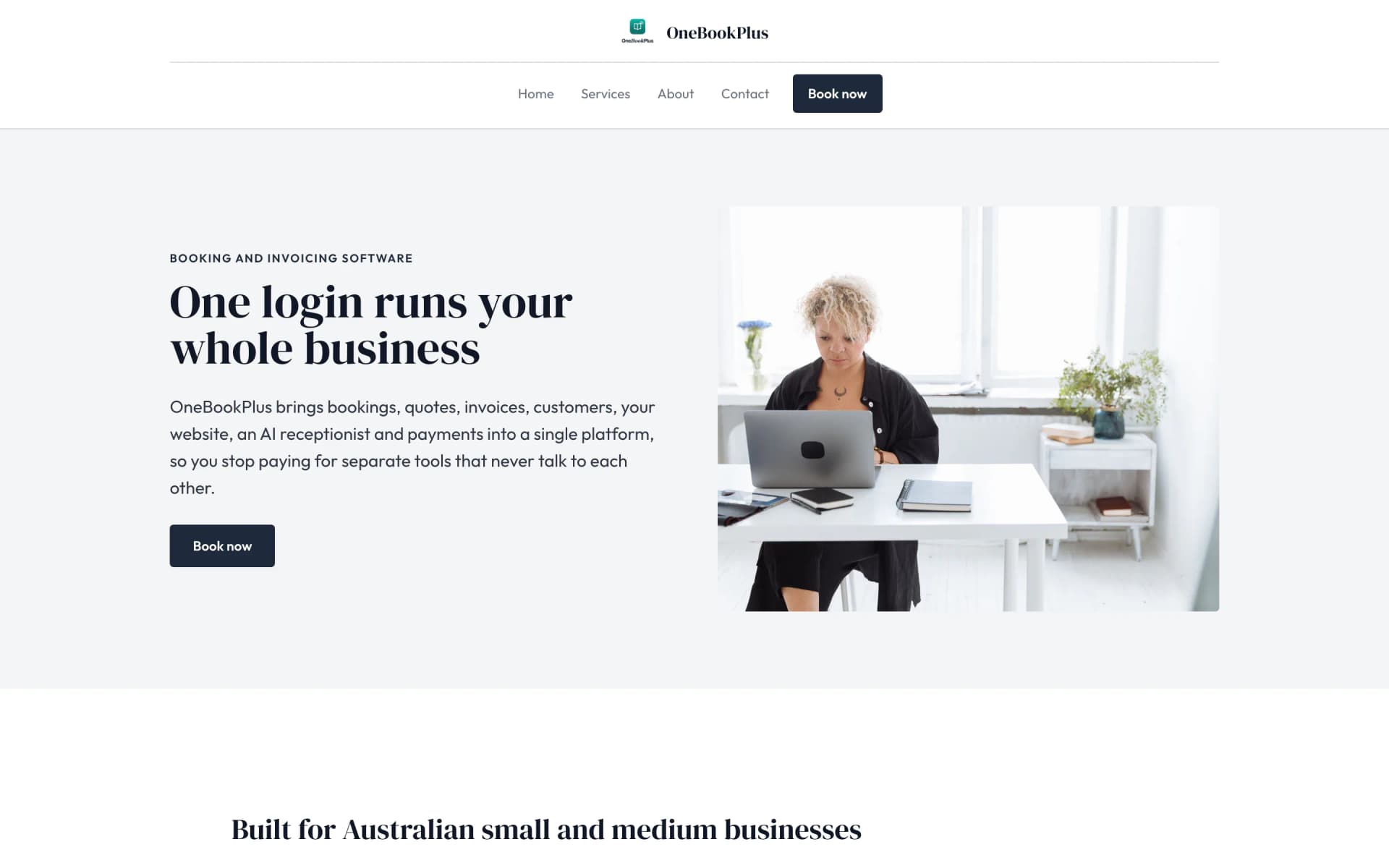 The OneBookPlus home page on a desktop: the logo and name centred over the menu with a dark Book now button, then the serif heading One login runs your whole business beside a framed photo of a woman at a laptop on a pale grey ground
