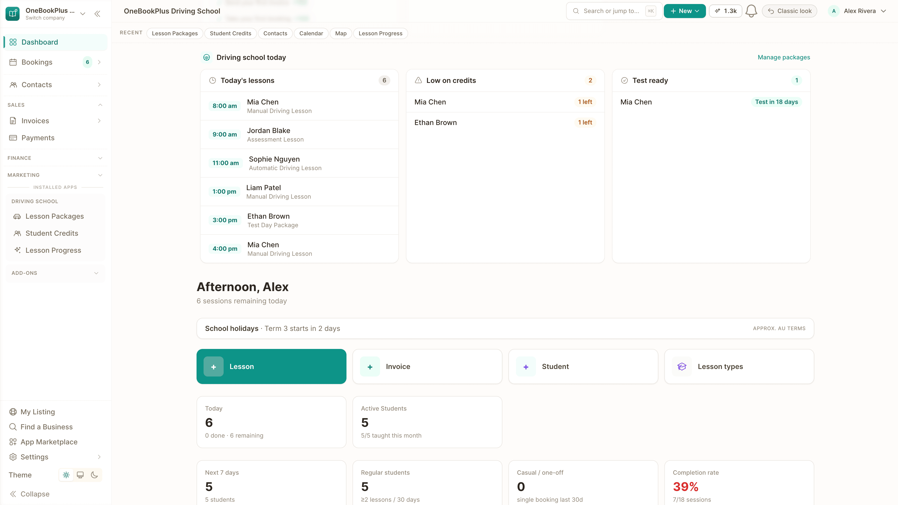 The driving-school dashboard in OneBookPlus on a laptop