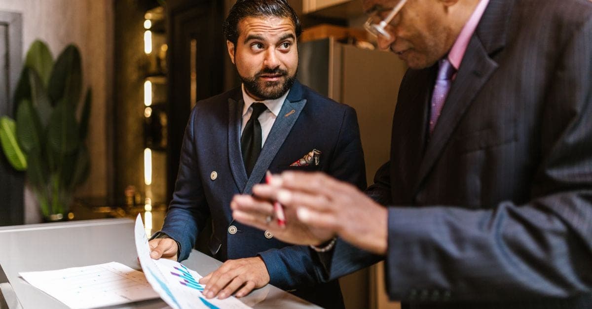 Business adviser reviewing growth strategy with a small business owner