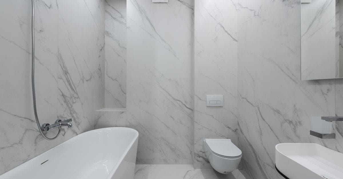 Toilet suite replacement — new close-coupled toilet suite fitted in a bathroom renovation