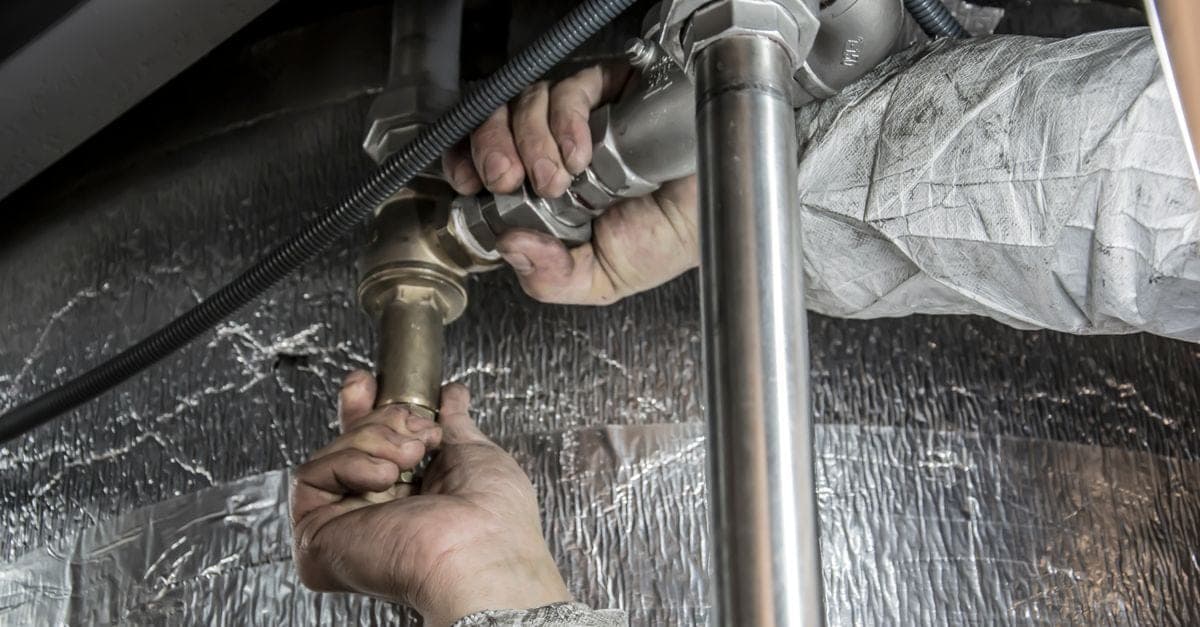 OneBookPlus plumber completing a hot water installation in Sydney